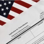 Form N-400 Application for Naturalization document next to an American flag, provided by USCIS Form Specialist
